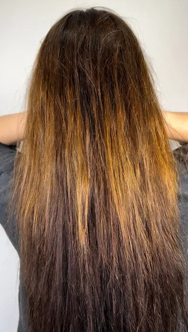 Manufacturer-provided before example showing long brunette hair
